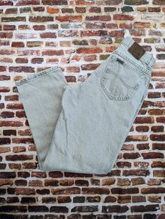 "These vintage Lee jeans are made from a tan colored denim that feels like all cotton. The tag inside is too faded to read. I believe they're sized for men, but I'm not completely sure. Consult the measurements to ensure a good fit. They have only very light wear. waist 30\" hips 41\" inseam 30.5\" rise 10\" 0319" Classic Faded Cotton Jeans, Vintage Washed Cotton Jeans, Vintage Washed Brown Jeans, Vintage Brown Washed Jeans, Vintage Washed Brown Bottoms, Vintage Straight Leg Beige Jeans, Vintage Khaki Cotton Jeans, Vintage Beige Straight Leg Jeans, Vintage Beige Jeans