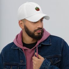 This Apple Fruit Dad Hat is expertly embroidered on a unisex, handmade dad cap. With an adjustable fit, this baseball gift cap is perfect for any apple lover. Enjoy the unique design and quality craftsmanship of this must-have accessory. Dad hats aren't just for dads. This one's got a low profile with an adjustable strap and curved visor. • 100% chino cotton twill • Green Camo color is 35% chino cotton twill, 65% polyester • Unstructured, 6-panel, low-profile • 6 embroidered eyelets • 3 ⅛” (7.6