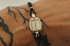 Pretty vintage women's Gruen Precision wrist watch circa the 1950s or so.  The face is white and marked with Gruen precision and Swiss on the face. Case is marked with 10K GF. Band is black leather, I believe. It is working.   Excellent vintage condition. Typical signs of age, such as small dings to the case and wear to the metal.  Please note: These are vintage, preworn and/or preloved items. I do my utmost best to list any issues, but signs of wear should be expected, and there are occasionally small things I won't deem worthy of note. Please feel free to send me a missive with any questions. I'm truly happy to help in any way possible and I'm always up for a chat. Any accessories shown, including crinolines, are for display only, not included unless otherwise stated. I lovingly curate a Small Band, Dark Look, Women Wrist Watch, Wrist Watches, 10k Gold, Womens Watches, The Face, Wrist Watch, Vintage Dresses