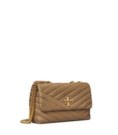 Directly from Tory Burch - The Small Kira Convertible Shoulder Bag is made of soft chevron-quilted leather with beveled Double T hardware. An adjustable chain strap adapts in the moment - doubled over the shoulder, or long and crossbody. Tory Burch Official Site. Kira Chevron Convertible Shoulder Bag, Tory Burch Kira Chevron, Kira Chevron, Tory Burch Kira, Womens Designer Handbags, Leather Roll, Pink Collection, Designer Shoulder Bags, Quilted Leather