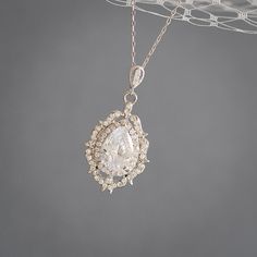 "Original Design by Glamorous Bijoux® This listing is for the LIBBY Necklace - This amazing pendant necklace features an unique vintage style filigree pendant with intricate details as the dramatic focal point, delicately embellished with pave rhinestones and cubic zirconia mounted in the setting to create an Old Hollywood glamour look. Carefully hung from a sterling silver or rose gold plated over sterling silver chain with an extender at the back. Measurements: Necklace length is approx. 16\" Pendant Necklace Vintage, Necklace Rose Gold, Filigree Pendant, Vintage Style Wedding, Necklace Wedding, Necklace Rose, Teardrop Pendant, Crystal Necklace Pendant, Necklace Vintage