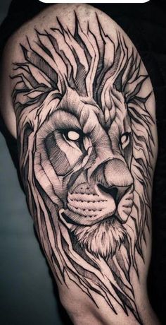 a man's arm with a lion tattoo on it, and the head of a lion