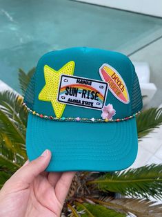 LETS GO TO HAWAII! 🌺☀️️This teal beach inspired trucker hat is perfect for all your summer activities.Hand picked iron on patches.  ️ Unisex  ️One size fits all ️Made in the USA  ️Adult fitting  ️Foam front, mesh back, & snap closure. Follow my instagram: @snapbacks.by.shannea Trendy 5-panel Trucker Hat For Beach, Summer Trucker Hat In 5-panel Style, Summer Trucker Hat 5-panel, Summer Trucker Hat With 5-panel Design, Summer Trucker Hat 5-panel Style, Summer Trucker Hat With Snapback, Beach-style Trucker Hat With 5-panel Design, Beach Trucker Hat With Flat Brim, Summer Snapback Trucker Hat