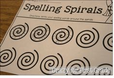 a close up of a piece of paper with spirals on it and the words spelling spirals