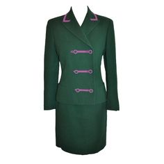 Gianni Versace Couture two-piece ensemble is Green with detailing of deep Fuchsia hue. The suit is double breasted and fully lined. The sleeves cuff have two buttons detailing. The skirt has a center back invisible zipper which measures 8" with a hook & eye on top. The length of the skirt is 21". The jacket has two small front pockets and because of the position of the front buttons, the jacket can be made up to two inches wider if needed. The back length of the jacket measures 23", back shoulde Vintage Skirt Suit, Purple Trim, Small Jacket, Versace Couture, Double Breasted Jacket, Gianni Versace, Women Clothes, Hook Eye, Skirt Suit