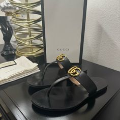 Good Condition, Light Wear On The Soles And Creasing, But Still Has Lots Of Life Left. Gucci Designer Sandals With Single Toe Strap, Designer Gucci Sandals With Single Toe Strap, Chic Gucci Sandals With Single Toe Strap, Gucci Black Sandals With Single Toe Strap, Designer Black Toe Post Sandals, Gucci Flat Sandals With Leather Sole, Shoes Gucci, Leather Thong Sandals, Gucci Black