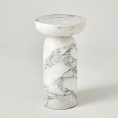 The Tumble Accent Table is a remarkable piece, made entirely from turned Arbescato White Marble. Its versatile design allows it to be placed in various spots around the room, offering both functionality and aesthetics. As marble is a natural product, please be aware that there will always be variations in veining and color. This is to be expected and makes every marble product uniquely your own. Dimensions Overall 20"H x 12"Dia. (115 lbs)  Weight Capacity: 75 lbs Dust with dry cloth 115 Lbs, Marble Furniture, Global Views, Furniture Removal, Natural Products, Tumbling, Accent Table, White Marble, Always Be