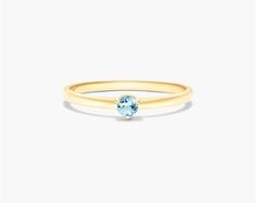 Add a touch of elegance to your look with the 14K Yellow Gold 1.8mm Petite Single Blue Topaz Birthstone Ring. The vivid blue topaz is a striking accent that will complement any look. The blue topaz is a December birthstone and is said to represent peace, tranquility, and loyalty. The ring is made of 14K yellow gold, which is a durable and precious metal. The ring is also very affordable, making it a great option for anyone looking for a stylish and affordable piece of jewelry.aka Gemstone Rings Senior Rings, Petite Rings, Topaz Birthstone Ring, Topaz Birthstone, Petite Ring, December Birthstone, Precious Metal, Birthstone Ring, Precious Metals