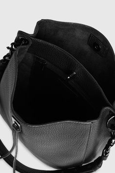 Divide and conquer with the perfect everyday bag. Made of supple leather, The Darren Shoulder Bag has a divider to compartmentalize your essentials—so you stay organized on the busiest of days. Style #: HH19MDND28 100% Genuine leather Black Shellac hardware Gunmetal studs on strap 10. 5"W X 11. 0"H X 4. 25"D 13. 5-20. 5" Adjustable Strap 1 Interior zip pocket 1 Exterior slide pocket Turn lock closure Unlined Imported The photos featuring a model are for size reference only. Actual color and mate Versatile Leather Office Bags, Everyday Leather Satchel Functional Style, Versatile Pebbled Leather Shoulder Bag For Work, Modern Leather Bucket Bag For Business, Modern Leather Business Bucket Bag, Everyday Calf Leather Crossbody Satchel, Textured Leather Satchel Bucket Bag For Work, Versatile Leather Satchel For Business, Workwear Shoulder Bag With Removable Pouch In Pebbled Leather