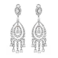 Handcrafted pear cut diamonds 2.03 ct chandelier 18 karat gold earrings. Accented with small round diamonds 19.38 ct. Diamonds are all natural and white in G-H Color Clarity VS. French / Omega clips. Width: 2.3 cm Length: 7.8 cm Weight: 26.35 g Pearl Chandelier Earrings, Diamond Chandelier Earrings, Teardrop Diamond, Gold Chandelier Earrings, White Gold Hoops, Platinum Earrings, Bridal Diamond Jewellery, 18k Gold Earrings, Pear Cut Diamond