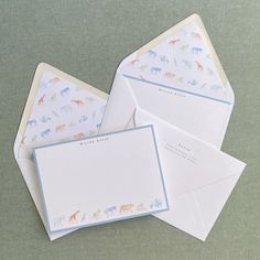 three envelopes with animals printed on them