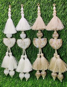 Indian Handmade Latkan Tassels for Saree Blouse Lehenga HandBags Hangings Dupatta Decoration Bridal Wedding dress for Women pair of 2 pcs Size - 22.00 cm Length  Item Description You can use this Beautiful pair of tassle for several DIY projects.  *These beautiful Tassel Latkans are used as the accessory for saree blouse on the back, but u can use according to your need and your innovative ideas. * Package contains 2 Latkan / 1 Pair Other Than Saree Blouse, you can use these latkans in various ways Craft Projects Designing Home Decoration Festive celebrations. Evening and party Apparels. Home décor items Apparel & Fashion Scarves n Stoles Headband, hats Table cover, curtains, Pillow covers, Cushion cover Shoe designing Headband, hats Table cover, curtains Designing stylish blouses Ship Fro Luxury Chandbalis With Latkans For Celebrations, Luxury Traditional Wear With Latkans For Women, Luxury Saree With Latkans For Festive Occasions, Cheap Elegant Danglers With Latkans, Cheap Latkans Drop Earrings, Elegant Cheap Danglers With Latkans, Cheap Chandbalis With Latkans, Cheap Chandelier Earrings With Latkans For Parties, Cheap Party Danglers With Latkans