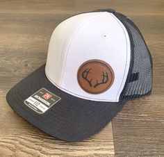 Richardson 112 Hat with Engraved Leatherette Patch Deer Silhouette Engraved on Leatherette Patch White Snapback Trucker Hat With Leather Patch, White Snapback Hat With Leather Patch, Adjustable White Trucker Hat With Leather Patch, White Trucker Hat With Leather Patch, Adjustable Hats With Leather Patch As Gift, Leather Patch Cap As A Gift, Leather Patch Cap As Gift, Leather Patch Cap - Gift, Leather Patch Cap Hat Gift