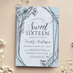 a blue and silver foiled sweet sixteen birthday party card with flowers on the side