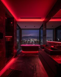 a large bathroom with red lights on the ceiling and tub in the middle of it