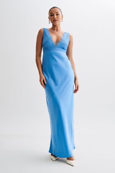 a woman in a long blue dress