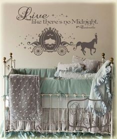 a baby's crib with a horse and carriage decal on the wall