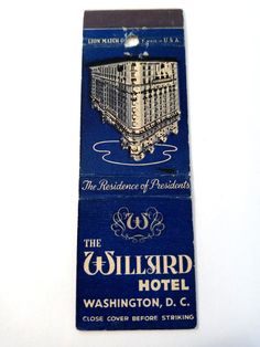 a blue and white business card with an image of a building