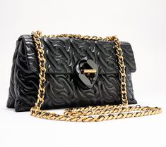 Elevate your everyday with this richly textured chain quilted leather crossbody, complete with a turnlock closure and sleek chain strap. From Rebecca Minkoff. Elegant Quilted Wallet On Chain Crossbody, Luxury Quilted Wallet On Chain, Designer Crossbody Wallet On Chain With Gold-tone Hardware, Evening Shoulder Bag With Chain Link And Gold-tone Hardware, Rebecca Minkoff Crossbody Bag, Quilted Leather, Chain Strap, Fashion Handbags, Rebecca Minkoff