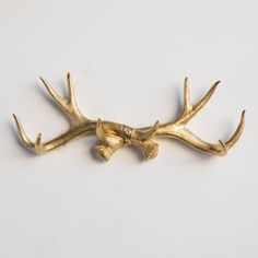 the antlers have been placed on top of each other to form a decorative piece