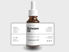 skincare oil bottle with label mockup on grey background, front and back side view