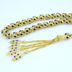 "Including the Silver Cord. It will be sent in lux gift box. General: 33 pcs Ø7.5x8 mm beads size Weight: 38.2 grams Length: 26 cm including tassel Material: 925 sterling silver, gold plated, Sapphire. See our other models here: http://www.etsy.com/shop/Tesbih?ref=si_shop Hand-made. Do not compare it to products sold in the shops. Each one makes the master. Tried using the most robust rope. Disperse a day in two days. Remain intact for many years. Does not Tarnish metals were used. The unique de Adjustable Gold Rosary Traditional Style, Adjustable Gold Traditional Rosary, Traditional Gold Beaded Rosary, Lux Gifts, Islamic Prayer, Prayer Beads, Gold Plated Silver, Rosary, Tassel Necklace