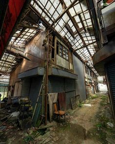 an abandoned building with lots of windows and doors