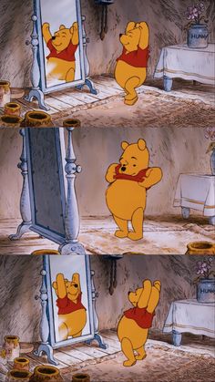 winnie the pooh is looking at himself in the mirror