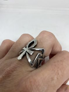 Cool Vintage Rock and Roll star men's ring Nice heavy ring vintage casting in silver white bronze Unused stock from the 1980's I have an assortment of sizes from 6.75, 7, 7.75, 12.75, 13, 13.25, 13.75 14 and 14.25 some half sizes. Please add your size to the order in a message and I will send the size you require. If I am out of stock in your size, I will list the ones I have available for replacement. My jeweler can re size them for a $20 fee. If I am sold out in the sizes you would prefer, I w Vintage Silver Ankh Jewelry, Retro Silver Ring Jewelry, Vintage Antique Silver Metal Rings, Retro Silver Rings For Collectors, Retro Silver Ring, Egyptian Ankh, Men Ring, Vintage Rock, Ring Photos