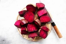 sliced beets on a plate with a knife