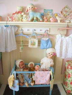 there is a baby crib with toys on the shelf and other stuff in it