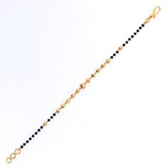 Weighing 4.3 grams, this 22k gold bracelet showcases a graceful yet jazzy design with black bead accents set against a radiant yellow gold finish. The 7.2-inch length, coupled with adjustable 0.6-inch links, ensures a perfect fit for any wrist. Secured by a hook lock, this bracelet offers a beautiful blend of traditional charm and modern flair, making it a versatile piece for both everyday wear and special occasions. PRODUCT DETAILS Gold Purity(karat): 22k Item Weight(grams): 4.3 Item Finish: Ye Festive Yellow Gold Bracelets With Round Beads, Black Bracelets For Festivals, Black Festive Bracelets For Festivals, Elegant Yellow Gold Bracelets With Black Beads, Elegant Yellow Gold Bracelet With Black Beads, Black Bangle Bracelets For Festive Occasions, Festive Black Bangle Bracelets, Festive Black Bangle Bracelet, Traditional Gold Bracelet With Black Beads