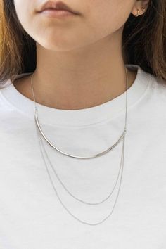 Bright, silver tri layered necklace to spruce up your wardrobe. Plated Brass Lobster clasp Extension Measurement: Short Chain: 15.5 in. / 39.3 cm. Extension: 2 in. / 5.08 cm. Drop: 3.25 in. / 8.2 cm. Chic Silver Layered Necklace With Adjustable Chain, Chic Multi-strand Silver Necklaces, Chic Silver Multi-strand Necklaces, Chic Silver Layered Metal Necklace, Silver Double Strand Layered Necklace For Everyday, Silver Minimalist Multi-strand Layered Necklace, Silver Multi-strand Necklace, Silver Multi-strand Everyday Necklace, Silver Multi-strand Necklace For Everyday