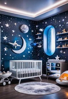 a baby's room decorated in blue and white with stars, moon and rockets