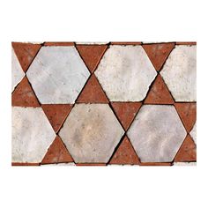 an image of a tile pattern that looks like hexagonals in white and brown