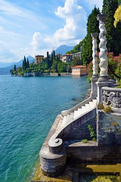 the stairs lead down to the water from the shore