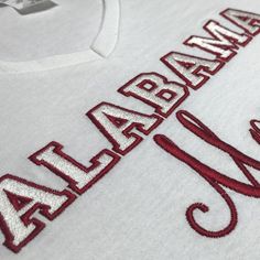 a white shirt with red letters on the front and bottom that says, atlanta braves