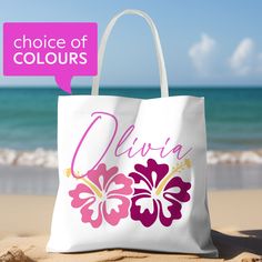 Get ready for a day by the shore with this fabulous personalized beach bag! Made from sturdy materials to hold all your beach essentials, this cute tote bag can be customized with your name or favorite phrase for a truly one-of-a-kind touch.  Whether you're soaking up the sun or strolling along the boardwalk, this stylish and practical beach bag will surely be your go-to accessory all summer. Grab yours today and make a splash wherever you go!  This custom tote bag is available in three sizes and features a roomy design with a square edge bottom, making it both stylish and practical. Choose from a variety of trendy colors to suit any style. Printed on both sides - note that the customization text is on 1 side only. Available in three sizes: * 13" x 13" * 16" x 16" * 18" x 18"   Product spe Customizable White Bag For Birthday, Pink Tropical Beach Bag, Tropical Pink Beach Bag, Pink Tropical Beach Bag For Vacation, Pink Tropical Style Beach Bag For Vacation, Personalized Pink Beach Bag, Multicolor Beach Bag For Beach Season Gift, Multicolor Beach Bag As Beach Season Gift, Pink Tropical Beach Bag For Travel