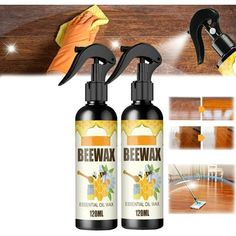 two bottles of beewax on top of a wooden floor next to a spray bottle