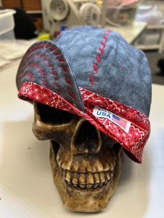 a skull wearing a baseball hat on top of a table