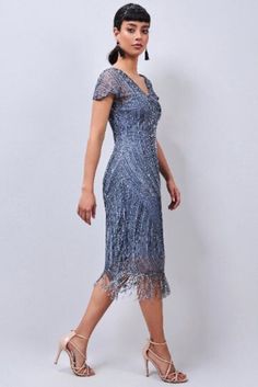 We are making all the sizes. If the size you are looking for out of stock please message us. Thanks to the key addition of the overwhelming dazzle of Fringe, this elaborately embroidered dress will Flapper your way into style this season. The Dorothy dress, our newest Flapper, is available in a gorgeous Black Silver. This is a diamond that will make a statement at any gathering. Take advantage of your stunning hand-beaded sequined dress before it sells out! This dress flatters all body types thanks to its great fit in the chest, tummy, and hips. Fitting tips: Fabric stretches. Sizes run true to size. - Front V neck - Front Back embellished - Embellished cap sleeves with Tassels - Made with soft stretch tulle and lined with soft stretch fabric to achieve a perfect - Height of regular size m Elegant Evening Flapper Dress, Elegant Formal Sequined Flapper Dress, Elegant Formal Flapper Dress With Sequins, Elegant Fitted Flapper Dress For Banquet, Elegant Sequined Flapper Dress For Formal Occasions, Fitted Flapper Style Cocktail Evening Dress, Elegant Sequined Flapper Dress For Banquet, Formal Flapper Style Fitted Evening Dress, Elegant Blue Flapper Dress For Evening