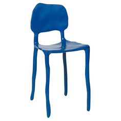 a blue plastic chair sitting on top of a white floor