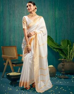 White Woven Kanjivaram Silk Saree  White Woven Kanjivaram Silk sarees are woven by skilled artisans in South India using traditional handloom techniques. The silk used in these sarees is renowned for its softness and luster.  Features Of White Woven Kanjivaram Silk Saree  Traditional Handloom Craft  Intricate Gold Brocade Work  Durability and Longevity   Size Fit  The model height is 5.7 ft   WASH AND CARE  Hand Wash only. Do not dry in direct sunlight    Legal Disclaimer:  The product is guaranteed to be 100% genuine. Product images are for illustrative purposes only. Images/packaging/ labels may vary from time to time due to changes made by the manufacturer's manufacturing batch and location. The product description is for information purposes only and may contain additional ingredients. Saree White, Saree Traditional, Kanjivaram Silk Saree, Gold Brocade, Navratri Special, South India, Packaging Labels, Product Images, Model Height