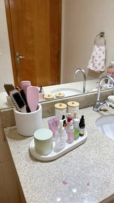 a bathroom counter with various items on it