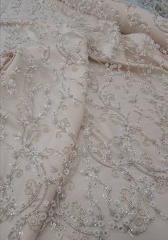 "Luxury embroidered lace fabric for wedding gown. Lace fabric with overlaid elements. 3D effect lace is a fabric of incredible magic. Delicate design with small flowers, embellished with beads and sequins. Such fabric will help to bring to life a completely graceful and sensual image of the bride. Lace width( 53\") 1.35 m. The price is for: 1) 0.5 yard - 82$ 2) 1 yard - 155$ Composition: 50% nylon, 50% polyester Width 1.35 (53 \") You can pick up the buttons in the color of the fabric here: http Elegant Embroidered Fabric For Mother Of The Bride, Elegant Embellished Embroidered Fabric For Mother Of The Bride, Elegant Embellished Fabric For Mother Of The Bride, Elegant Lace Fabric With 3d Embroidery, Elegant Floral Embroidered Fabric For Wedding, Elegant Embroidered Fabric With Pearl Embroidery For Reception, Elegant Embellished Embroidered Organza Fabric, Elegant Pearl Embroidered Fabric For Reception, Elegant Silver Embroidered Organza Fabric