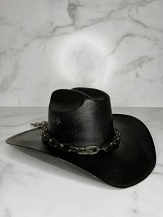 "The Dark Horse hat is Howdy Mear's most popular style as it goes with everything and can be dressed up or down. Great for a bachelorette weekend, game day, or night out! Black cowboy hat with matte black chain. Hats come in size S/M (measures 22 1/2 inches around crown) and M/L (measures 23 3/8\" around crown). Every hat is handcrafted from start to finish. Slight variation in the appearance of each uniquely made item is to be expected." Gothic Cowboy Hat, Goth Cowboy Hat, Black Cowgirl Hat, Dark Cowboy, Bachelorette Cowgirl, Butterfly Stomach, Dark Western, Goth Cowboy, Cowboy Accessories