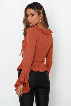 Length from shoulder to hem of size S: 51cm. Rust cardigan. Non-lined. Cold hand wash only. Model is a standard XS and is wearing XS. True to size. Stretchy purl knit fabric. Adjustable front ties. Polyester. So chic! The perfect desk to dinner essential, our ruffled Thousand Songs Knit Cardi matches your selection of basic camisoles and plain tees with ease. Made from a stretchy purl knit fabric, the cardi boasts flared sleeves along with adjustable ties to the front. Rust Cardigan, Purl Knit, Knit Cardi, Spring Knits, Sweater Tops, Perfect Desk, White Brick, Plain Tees, Knitted Tops