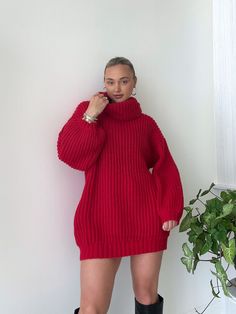 Details: Turtleneck sweater dress Chunky knit Oversized Ribbed Wide sleeves Size + Fit: Model is 5'4 Wearing size small Fabric + Care: 100% polyester Knit Sweater Dress Outfit, Crochet Winter Dresses, Flame Sweater, Orange Sweater Dress, Chunky Knit Sweaters, Crochet Sweater Dress, Bright Sweater, Christmas Sweater Dress, Oversized Sweater Outfit