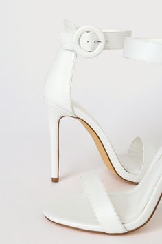 The Lulus Saylana White Ankle Strap Heels are the perfect plus one for any occasion! These sleek faux leather heels have a single sole silhouette, a slender toe strap, and a sturdy heel cup. Round covered buckle secures the ankle strap. 4" stiletto heel. Cushioned insole. Rubber sole has nonskid markings. Man made materials. Imported. Lulus | Saylana White Ankle Strap Heels | Size 11. White Ankle Strap Heels, Faux Leather Heels, Size 11 Heels, Ankle Strap Heels, Strap Heels, Stiletto Heel, Leather Heels, Wedding Shoe, Stiletto Heels