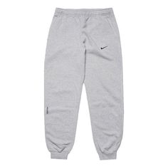 Nike x Drake NOCTA NRG Fleece Pants 'Grey' FN7661-063 Nike Gray Sports Pants, Nike Sports Pants In Gray, Nike Gray Cotton Sweatpants, Nike Winter Streetwear Pants, Nike Gray Pants With Pockets, Nike Pants For Winter Streetwear, Nike Gray Sportswear Sweatpants, Nike Gray Sweatpants For Streetwear, Nike Gray Loungewear Pants